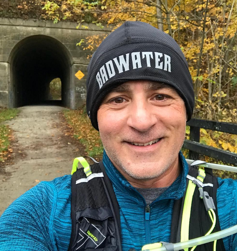 Eric Zurlo Running Gravel trail through tunnel